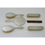 A six piece silver dressing table set with London hallmarks