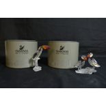 Two boxed Swarovski crystal ornaments comprising lovebirds and a pelican