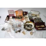 A large bag of modern dress jewellery including some silver