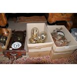 A collection of anniversary clocks under glass domes, wall clocks and carriage type clocks.