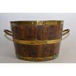 An oak and brass bound jardiniere.