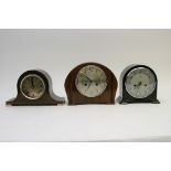 A collection of three mantel clocks,