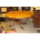 A Victorian burr walnut loo table the oval top on a four pillar base with splayed legs