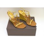 A pair of ladies Louis Vuitton Capricieuse patent wedge sandals in brown and yellow,