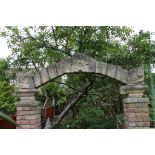 A carved stone Arch with gargoyles (please note this lot is sold in situs and the buyer is to