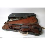 Two cased antique violins and bows.