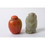 A coral scent bottle together with a carved jade figure of an Oriental elder.