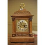 An Edwardian walnut mantel clock,