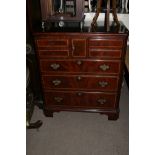 A mahogany and cross banded cabinet with a hinged front