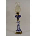 A Quality Victorian blue overlay and brass mounted oil lamp