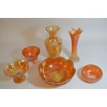 A collection of carnival glass items.