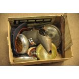 A box of automobilia including an oil can, spot lamps,