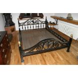 A bespoke wrought iron bed frame with scroll decoration and vertical supports 183x142 cm frame size