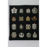 A collection of sixteen various Canadian Scottish badges including Calgary Highlanders,