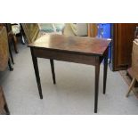 A Georgian mahogany side table of rectangular shape on square tapering legs
