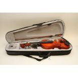 A modern violin in a fitted case