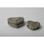 Two small silver heart shaped trinket boxes,