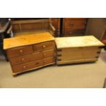 A pine box with hinged lid and a modern chest of pine drawers,
