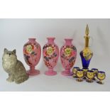 A collection of ceramics and glass comprising a garniture of three hand painted Victorian vases,