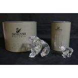 A boxed Swarovski crystal polar bear with a smaller model