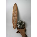 An African tribal face mask of with animal hide cowl. together with a painted wooden tribal shield.