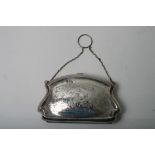 An engraved silver purse,