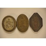 A collection of three brass gun printing metal seals