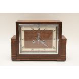 An Art-Deco, oak and chrome mantle clock of stylish design with inlaid banded decoration,