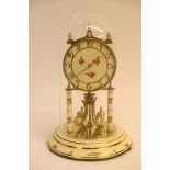 A brass anniversary clock withy painted decoration