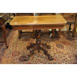 A quality Victorian rosewood card table the twin flap top on a spiral fluted column,