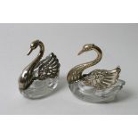 Two swan shaped facet cut glass and silver salts