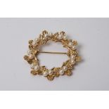 A 9ct gold open brooch mounted with cultured pearls