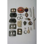 A collection of various items to include some silver, including buckles,