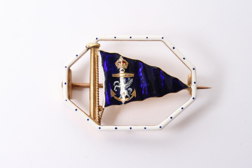 A rare 18ct gold and enamel Benzie of Cowes brooch in the form of a Royal blue flag with applied