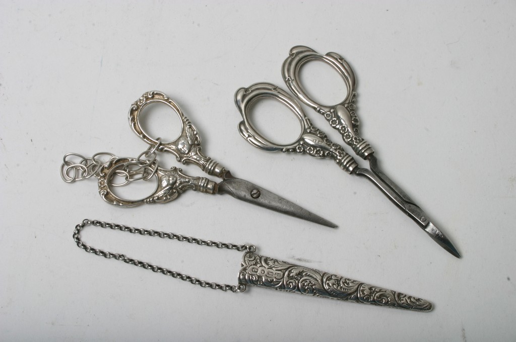 Two pairs of silver scissors,