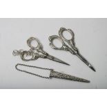 Two pairs of silver scissors,