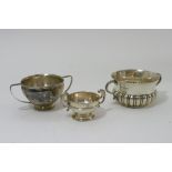 A collection of three small silver bowls