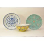 A Chinese 20th century famile jaune yellow glazed bowl and two blue and white dishes (3)