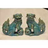 A pair of Chinese dogs of fo with a turquoise glaze