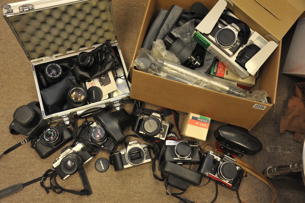 A collection of various cameras and accessories.