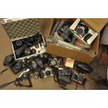 A collection of various cameras and accessories.