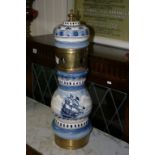 A large Delft blue and white beer pump