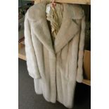 A vintage synthetic white fur jacket