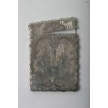A quality Victorian silver card case with shaped and engraved decoration,