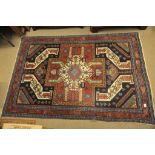 A hand knotted rug with a geometric pattern possible Kazack size 190x130 cm approx