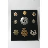 A collection of nine various Royal Scots badges including Victorian Plaid brooch as well as some