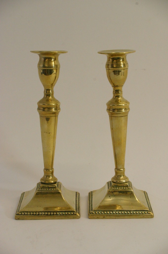 A pair of 19th century brass candlesticks.