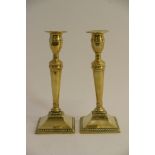 A pair of 19th century brass candlesticks.