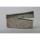 A silver gilt card case of curved shaped with engraved decoration, Birmingham hallmarks for M.H.