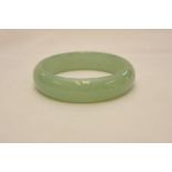 A pale green jadite bangle,